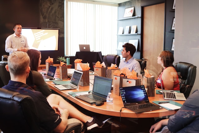 Colleagues around a conference table during a host-company briefing